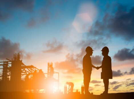 silhouette engineer shake hand